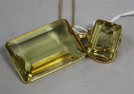 A modern 14ct gold mounted large citrine pendant on 9ct gold chain and a similar 14ct gold dress ring.